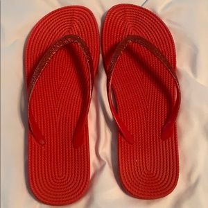 Red sparkle flip flops
